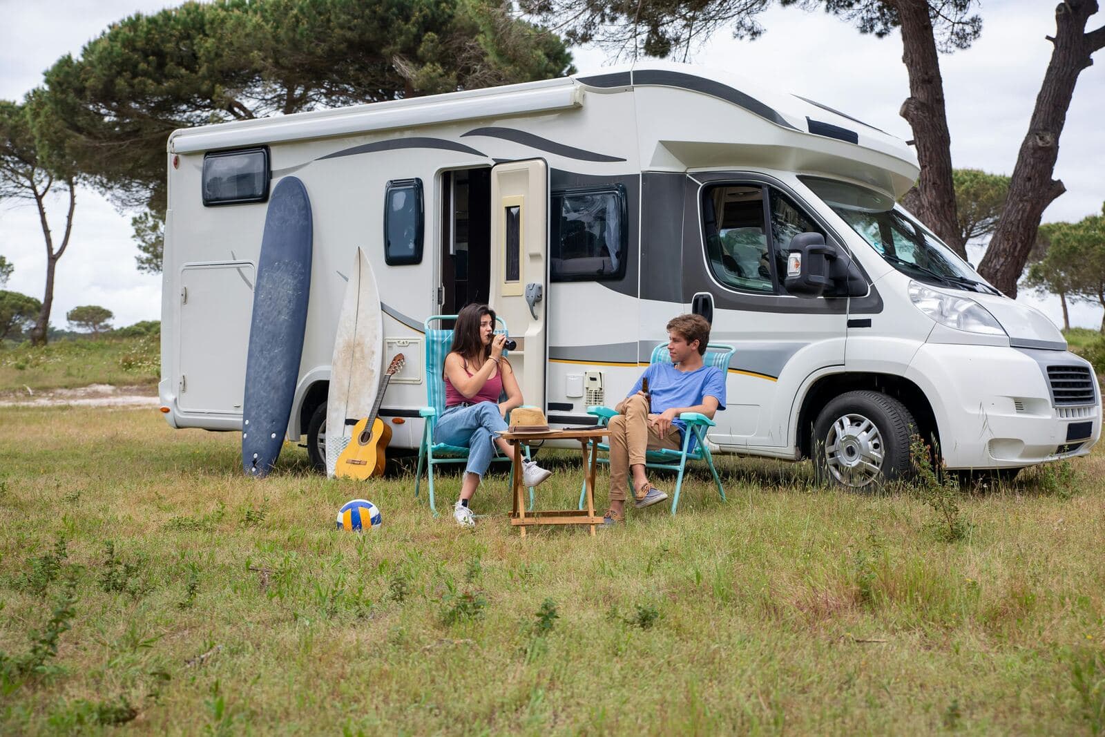 Couple staging their caravan, ready for sale photography